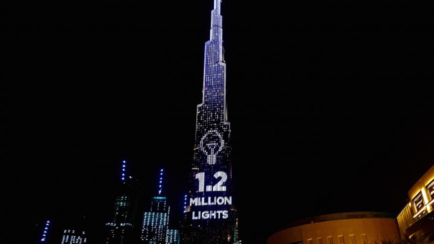 Dubai's Burj Khalifa, the world's tallest building, lit its 1.2 million lights to become the world's tallest donation box to buy meals for people hit by the impact of the new coronavirus disease (COVID-19) pandemic in Dubai, United Arab Emirates May 11, 2020. Picture taken May 11, 2020. REUTERS/Abdel Hadi Ramahi - RC2ZMG9GPAR0