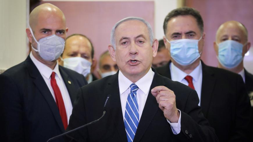 Israeli Prime Minister Benjamin Netanyahu delivers a statement before entering the district court room where he is facing a trial for alleged corruption crimes, in Jerusalem May 24 2020. Yonatan Sindel/Pool via REUTERS - RC21VG97J050