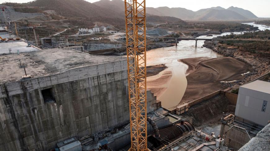(FILES) This file photo taken on December 26, 2019 shows a general view of the Blue Nile river as it passes through the Grand Ethiopian Renaissance Dam (GERD), near Guba in Ethiopia. - The Nile, Egypt's lifeline since Pharaonic days, faces massive strain from pollution, over-use and climate change -- and now the threat of a colossal dam being built far upstream in Ethiopia. When its London-sized reservoir starts to fill this summer, Egypt fears the mega-project will spell an existential threat to its teemin