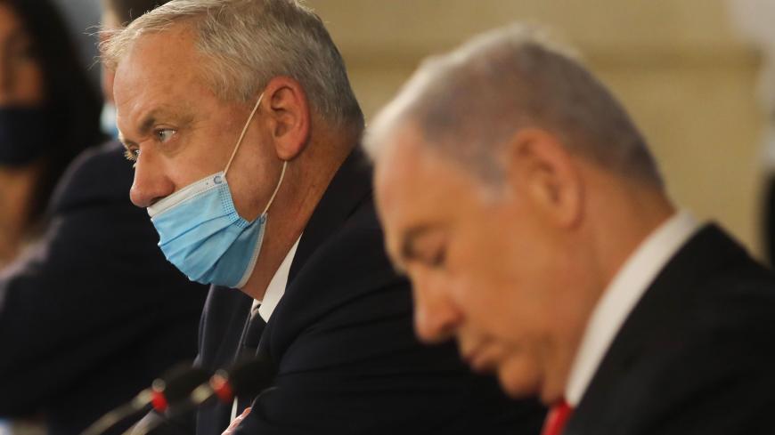 Israeli Prime Minister Benjamin Netanyahu and Alternate PM and Defence Minister Benny Gantz attend the weekly cabinet meeting in Jerusalem on June 7, 2020. - Netanyahu urged world powers to reimpose tough sanctions against Iran, vowing to curb Tehran's regional "aggression" hours after another deadly strike on pro-Iranian fighters in Syria. (Photo by Menahem KAHANA / AFP) (Photo by MENAHEM KAHANA/AFP via Getty Images)