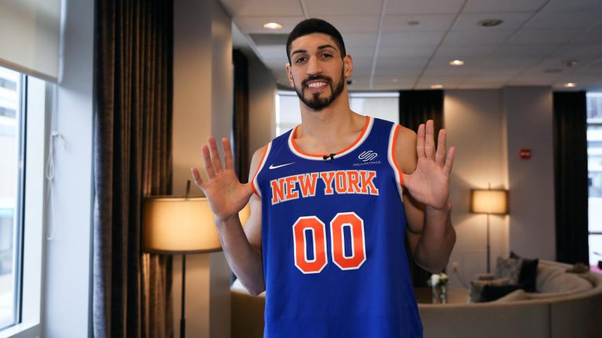 Turkish NBA player Enes Kanter stands for a portrait holding his jersey during half time after watching his team, the New York Knicks, play the Washington Wizards at the O2 Arena in London on television in White Plains, New York, U.S., January 17, 2019. REUTERS/Caitlin Ochs - RC1DBFA4CF40