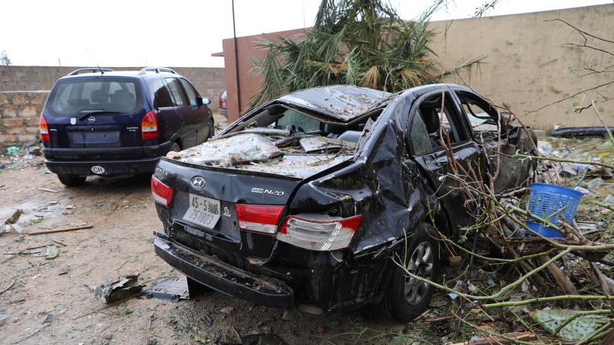 A damaged car is seen after an air strike at Tajura neighbourhood, east of Tripoli, Libya December 30, 2019.  REUTERS/Ismail Zitouny - RC2M5E9QJKS3