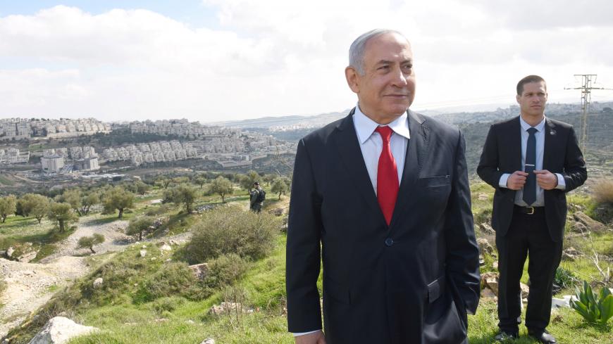 Israeli Prime Minister Benjamin Netanyahu stands at an overview of the Israeli settlement of Har Homa, located in an area of the Israeli-occupied West Bank, that Israel annexed to Jerusalem after the region's capture in the 1967 Middle East war, February 20, 2020. Debbie Hill/Pool via REUTERS - RC2E4F92VRA5