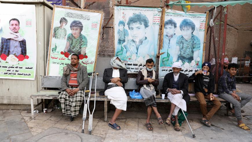 People sit at a market's cafe amid novel coronavirus spread concerns in the old quarter of Sanaa, Yemen June 2, 2020. REUTERS/Khaled Abdullah - RC241H9ZK3EW