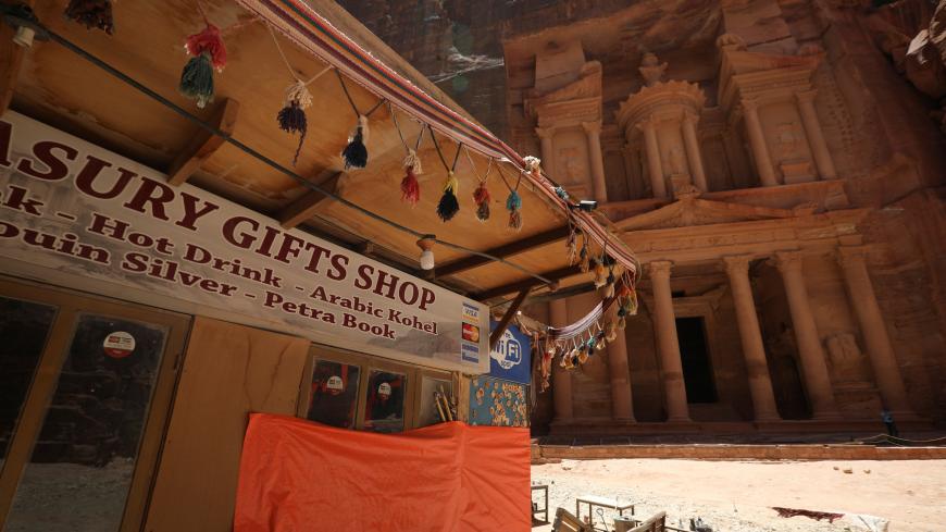 A closed souvenir shop in front of the treasury site in the ancient city of Petra is seen empty of tourists after the government closed all tourist facilities in the country amid concerns over the spread of the coronavirus disease (COVID-19), Jordan June 3, 2020. REUTERS/Muhammad Hamed - RC2V1H9EE04C