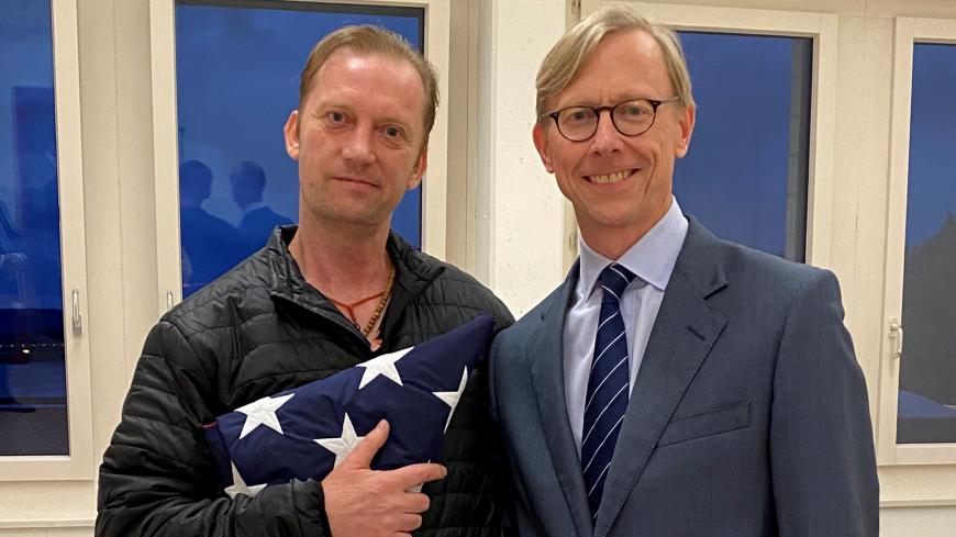 Michael White, a freed U.S. Navy veteran detained in Iran since 2018, poses with U.S. Special Envoy for Iran Brian Hook while on his return to the United States at Zurich Airport in Zurich, Switzerland June 4, 2020.  U.S. State Department/Handout via REUTERS. THIS IMAGE HAS BEEN SUPPLIED BY A THIRD PARTY. THIS IMAGE WAS PROCESSED BY REUTERS TO ENHANCE QUALITY, AN UNPROCESSED VERSION HAS BEEN PROVIDED SEPARATELY. - RC2K2H90N3HH