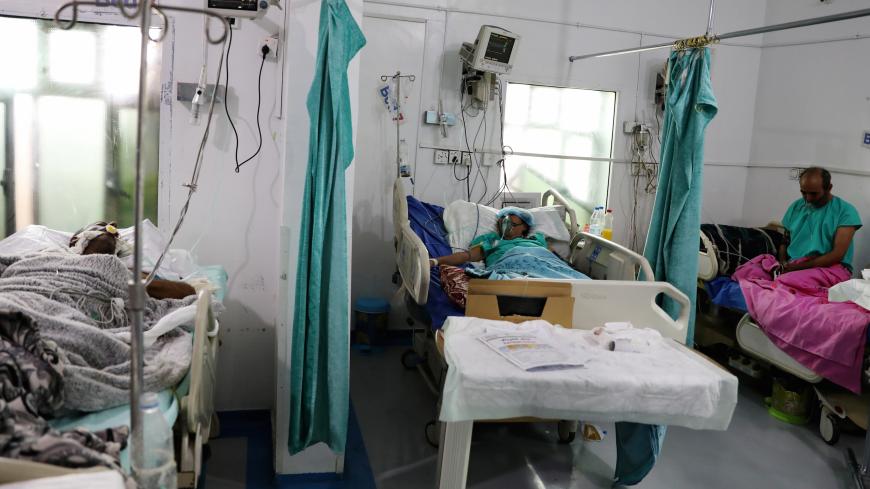 People recovering from the coronavirus disease (COVID-19) are pictured at a quarantine ward of a hospital in Sanaa, Yemen June 11, 2020. REUTERS/Khaled Abdullah - RC217H9IXKHA