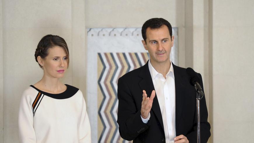 Syria's President Bashar al-Assad stands next to his wife Asma, as he addresses injured soldiers and their mothers during a celebration marking Syrian Mother's Day in Damascus, in this handout picture provided by SANA on March 21, 2016. REUTERS/SANA/Handout via Reuters ATTENTION EDITORS - THIS PICTURE WAS PROVIDED BY A THIRD PARTY. REUTERS IS UNABLE TO INDEPENDENTLY VERIFY THE AUTHENTICITY, CONTENT, LOCATION OR DATE OF THIS IMAGE. FOR EDITORIAL USE ONLY. NOT FOR SALE FOR MARKETING OR ADVERTISING CAMPAIGNS. 