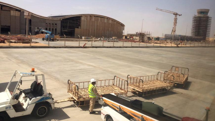 A worker stands at the construction site of Duqm Airport, Oman, August 21, 2017. Picture taken August 21, 2017. REUTERS/Nawied Jabarkhyl - RC1888554580