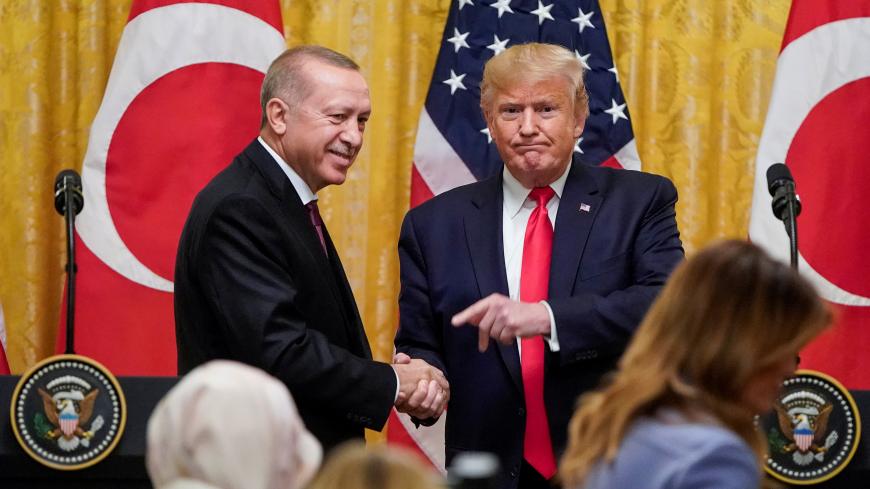 U.S. President Donald Trump greets Turkey's President Tayyip Erdogan during a joint news conference at the White House in Washington, U.S., November 13, 2019. REUTERS/Joshua Roberts - RC2MAD9EDAA8