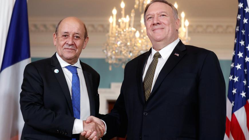 U.S. Secretary of State Mike Pompeo and French Foreign Minister Jean-Yves Le Drian pose for a photo at the State Department in Washington, U.S., November 14, 2019. REUTERS/Yara Nardi - RC27BD95PIEM
