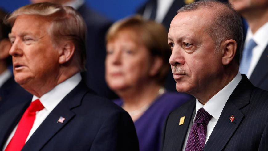 U.S. President Donald Trump and Turkey's President Tayyip Erdogan pose for a family photo during the annual NATO heads of government summit at the Grove Hotel in Watford, Britain December 4, 2019.  REUTERS/Peter Nicholls/Pool - RC2COD9N7WI1