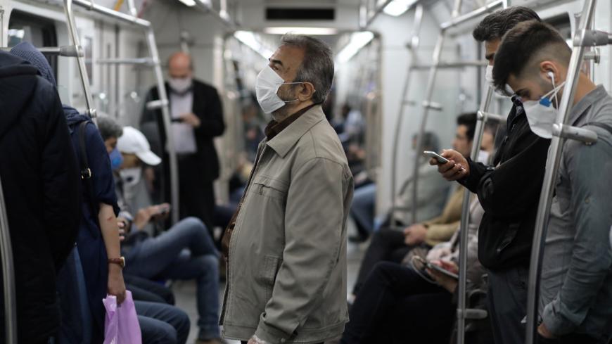 Iranians wear protective face masks, following the outbreak of the coronavirus disease (COVID-19), as they drive with the metro, in Tehran, Iran, May 20, 2020. WANA (West Asia News Agency)/Ali Khara via REUTERS ATTENTION EDITORS - THIS PICTURE WAS PROVIDED BY A THIRD PARTY - RC2FSG9AESAO
