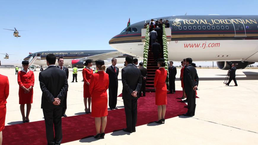Jordanian flight attendants participate in a special ceremony to receive two new Airbus A330-200 acquired by the state carrier Royal Jordanian at Queen Alia International Airport in Amman on May 24, 2010. The ceremony was held as part of Independence Day celebrations which fall on May 25th. AFP PHOTO/KHALIL MAZRAAWI (Photo credit should read KHALIL MAZRAAWI/AFP via Getty Images)