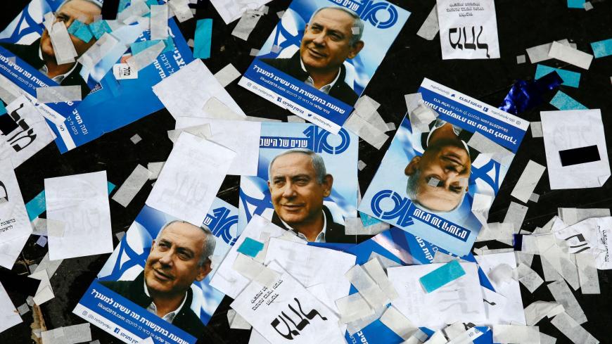 TOPSHOT - This picture taken early on April 10, 2019 shows Israeli Likud Party campaign material and posters of Prime Minister Benjamin Netanyahu strown on the floor following election night at the party headquarters in the coastal city of Tel Aviv. (Photo by Jack GUEZ / AFP)        (Photo credit should read JACK GUEZ/AFP via Getty Images)