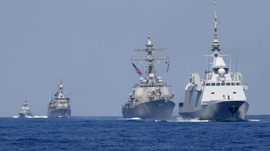 A photo taken on August 7, 2019, shows the French anti-submarine frigate FREMM Auvergne (R) and the US Navy USS Donald Cook class guided missile destroyer (2R) and the Greek HS Aigaion frigate (2L) during an exercise how simulate a humanitarian response to a powerful earthquake and significant movement of IDF vessels and foreign vessels in the Mediterranean sea. - Sailors from France, Greece and the United States arrived on their vessels and were joined by the Israelis off the Israeli port city of Haifa for