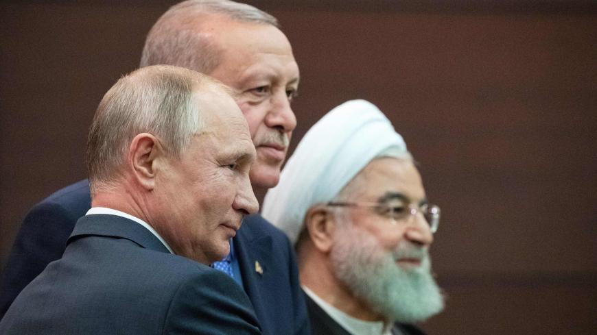 Turkish President Recep Tayyip Erdogan (C), Russian President Vladimir Putin (L) and Iranian President Hassan Rouhani attend a joint press conference following a trilateral meeting on Syria, in Ankara on September 16, 2019. (Photo by Pavel Golovkin / POOL / AFP)        (Photo credit should read PAVEL GOLOVKIN/AFP via Getty Images)