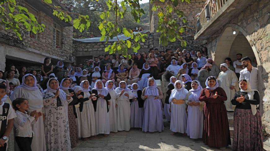 Iraqi Yazidis take part in a religious ceremony at the Temple of Lalish, in a valley near the Kurdish city of Dohuk, about 430km northwest of the Iraqi capital Baghdad, on October 10, 2019. - Of the 550,000 Yazidis in Iraq before the Islamic State (IS) group invaded their region in 2014, around 100,000 have emigrated abroad and 360,000 remain internally displaced. (Photo by SAFIN HAMED / AFP) (Photo by SAFIN HAMED/AFP via Getty Images)