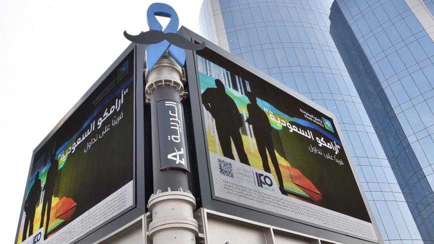 A billboard displaying an advert for Aramco is pictured in the Saudi capital Riyadh on November 10, 2019. - From robots to sniffer drones, Saudi Aramco has ramped up spending on technological innovation while its rivals cut back amid soft oil prices, but the energy giant risks losing its edge after its much-anticipated IPO. Saudi Arabia is offering a sliver of the company, touted as the kingdom's crown jewel, in its upcoming initial public offering that is the bedrock of Crown Prince Mohammed bin Salman's a