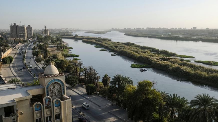 This picture taken on November 26, 2019 shows a view of the church of the Coptic Orthodox Church of Saint George and its adjacent service building, overlooking the Nile river in the Egyptian capital Cairo's southern suburb of Kozzika, about 15 kilometres south of the city centre. - Egypt has for years been suffering from a severe water crisis that is largely blamed on population growth. Mounting anxiety has gripped the already-strained farmers as the completion of Ethiopia's gigantic dam on the Blue Nile, a