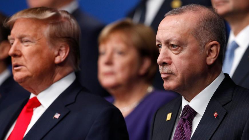 US President Donald Trump (L) and Turkey's President Recep Tayyip Erdogan (R) pose for the family photo at the NATO summit at the Grove hotel in Watford, northeast of London on December 4, 2019. (Photo by PETER NICHOLLS / various sources / AFP) (Photo by PETER NICHOLLS/AFP via Getty Images)