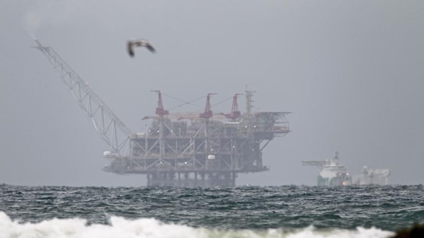 The platform of the Leviathan natural gas field in the Mediterranean Sea which started production today is pictured from the Israeli northern coastal city of Dor on December 31, 2019. - Israel's offshore Leviathan field started pumping gas today in what the operating consortium called "a historic turning point in the history of the Israeli economy."
A joint statement from partners Noble Energy, Delek Drilling, and Ratio said that the start of production was expected to lead to an immediate reduction in dome