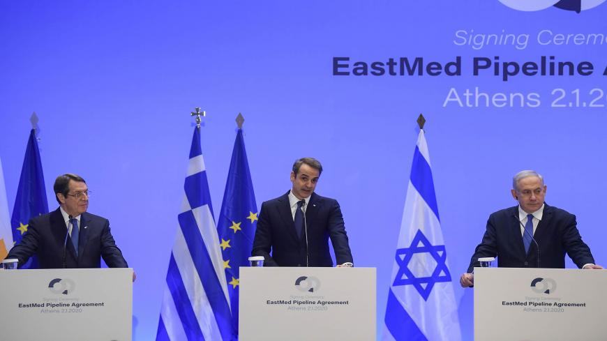 Greek Prime Minister Kyriakos Mitsotakis (C) speaks during a press conference with Israel's Prime Minister Benjamin Netanyahu (R) and Cypriot President Nikos Anastasiadis (L) in Athens on January 2, 2020 following  the signing ceremony of an agreement for the EastMed pipeline project designed to ship gas from the eastern Mediterranean to Europe in Athens on January 2, 2020. (Photo by ARIS MESSINIS / AFP) (Photo by ARIS MESSINIS/AFP via Getty Images)