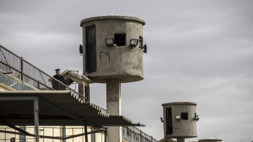 A picture taken during a guided tour organised by Egypt's State Information Service on February 11, 2020, shows an Egyptian policeman near watch towers at Tora prison in the Egyptian capital Cairo. (Photo by Khaled DESOUKI / AFP) (Photo by KHALED DESOUKI/AFP via Getty Images)