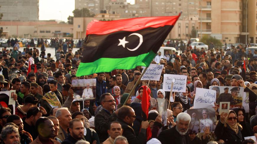 Supporters of Libyan military strongman Khalika Haftar wave a national flag as they take part in a demonstration in the coastal city of Benghazi in eastern Libya, against Turkish intervention in the country's affairs on February 14, 2020. - Haftar launched an offensive last April to seize the capital Tripoli, the seat of the UN-recognised Government of National Accord (GNA).
Haftar has the backing of Egypt, the United Arab Emirates and Russia, among others, while the GNA is mainly supported by Qatar and Tur