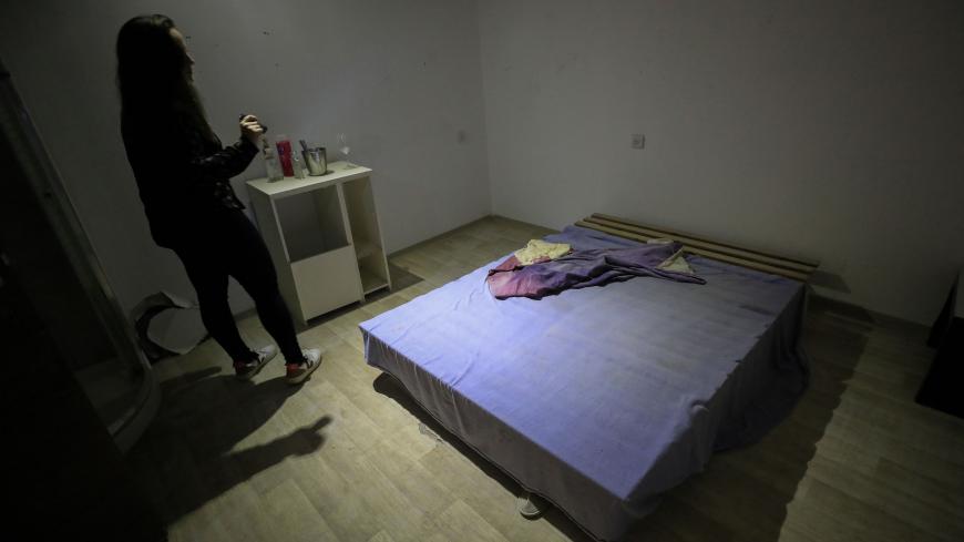 A woman visits a room in the undergrounds premises of the former Pussycat strip club, turned into a local NGOs community centre and small museum, in the coastal Mediterranean city of Tel Aviv on March 5, 2020. - The demise of Tel Aviv's strip clubs was accelerated in 2018, when Israel's parliament, the Knesset, passed a law banning brothels. But the final straw came in April last year when the public prosecutor issued a directive to clamp down on lap dances, arguing they could in some cases be viewed as pro