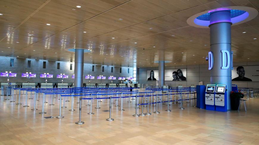This picture taken on May 14, 2020 shows a view of the empty check-in counters of Israel's national flag carrier El-Al, at a terminal at Ben-Gurion International Airport near Tel Aviv, due to the COVID-19 coronavirus pandemic. - El Al's CEO Gonen Ussishkin had written Prime Minister Benjamin Netanyahu a personal letter asking for assistance. The airline company had rejected an aid package drafted by the Finance Ministry, and is seeking government backing for a $400 million loan from Israel Discount Bank and