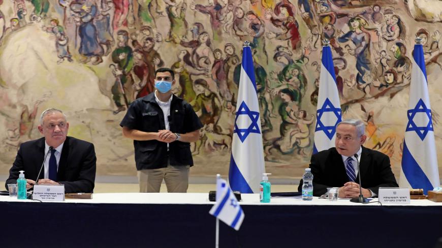Israeli Prime Minister Benjamin Netanyahu (R) and Alternate Prime Minister and Defence Minister Benny Gantz (L) attend a cabinet meeting of the new government at Chagall State Hall in the Knesset (Israeli parliament) in Jerusalem on May 24, 2020. (Photo by ABIR SULTAN / POOL / AFP) (Photo by ABIR SULTAN/POOL/AFP via Getty Images)