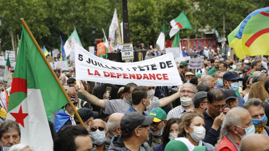 People attend a demonstration in Paris on July 5, 2020 in support of Algeria's Hirak key protest movement as Algeria celebrates today the anniversary of its 1962 independence from France. (Photo by FRANCOIS GUILLOT / AFP) (Photo by FRANCOIS GUILLOT/AFP via Getty Images)