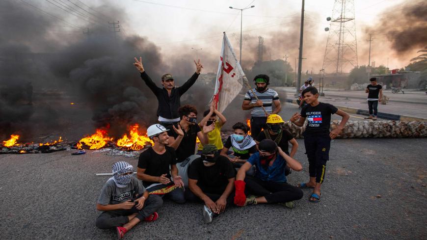 Demonstrators block a road during a protest in the southern city of Basra on July 14, 2020, as protesters gathered to denounce the lack of electricity and services. (Photo by Hussein FALEH / AFP) (Photo by HUSSEIN FALEH/AFP via Getty Images)