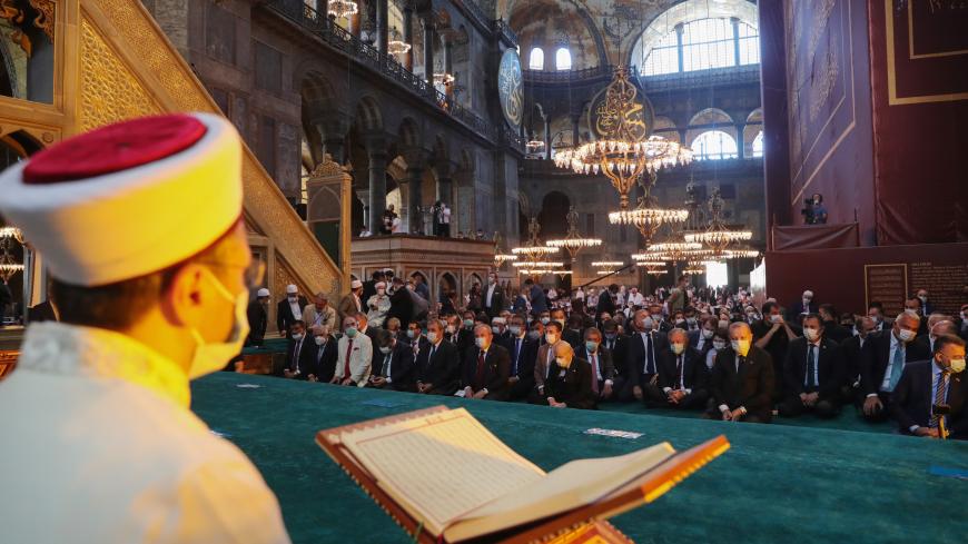 ISTANBUL, TURKEY - JULY 24: In this handout picture released by the Turkish Presidential press office, Turkey's President Recep Tayyip Erdogan and invited guests attend Friday prayers at Hagia Sophia Grand Mosque during the buildings first official prayers after being reconverted into a mosque on July, 24, 2020 in Istanbul, Turkey. (Photo by Handout/Turkish Presidential Press Office/Getty Images)