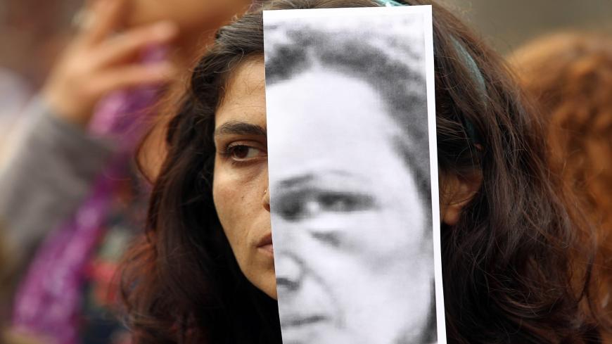 Turkish women display photographs of slain student, Özgecan Aslan, who was killed while resiting an attempted rape, and other victims of violence against women during a demonstration in Ankara on June 12, 2015.   Three men went on trial in Turkey over the murder and attempted rape of a 20-year-old female student, in a case that sparked an outpouring of anger over the level of violence against women in the country. Ozgecan Aslan was murdered in the southern region of Mersin in February while returning home f
