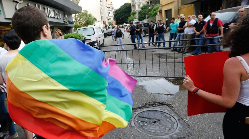 Activists from of the Lebanese LGBT community take part in a protest outside the Hbeish police station in Beirut on May 15, 2016, demanding the release of four transsexual women and calling for the abolishment of article 534 of the Lebanese Penal code, which prohibits having sexual relations that "contradict the laws of nature". / AFP / ANWAR AMRO        (Photo credit should read ANWAR AMRO/AFP via Getty Images)