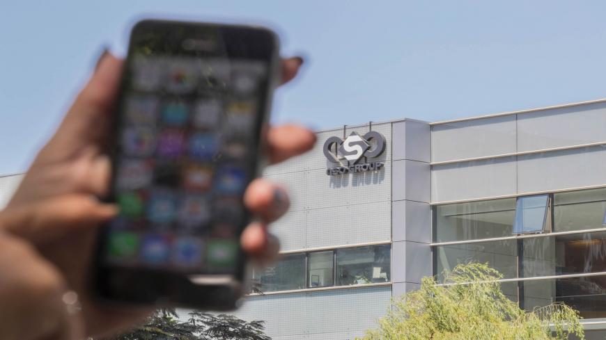 An Israeli woman uses her iPhone in front of the building housing the Israeli NSO group, on August 28, 2016, in Herzliya, near Tel Aviv.
Apple iPhone owners, earlier in the week, were urged to install a quickly released security update after a sophisticated attack on an Emirati dissident exposed vulnerabilities targeted by cyber arms dealers.
Lookout and Citizen Lab worked with Apple on an iOS patch to defend against what was called "Trident" because of its triad of attack methods, the researchers said in a