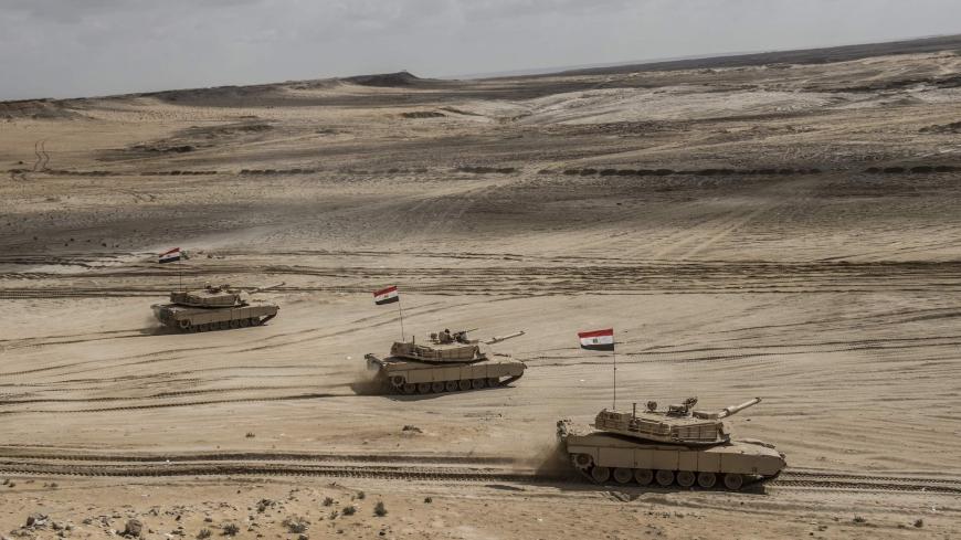 TOPSHOT - Egyptian tanks take part in the Arab Shield joint military exercises at Mohamed Naguib military base in El-Hamam near the Mediterranean coast, about 240 kilometres northwest of the capital Cairo on November 15, 2018. - Forces from Saudi Arabia, Egypt, the UAE, Kuwait, Bahrain and Jordan are taking part in the maneuvers. (Photo by Khaled DESOUKI / AFP)        (Photo credit should read KHALED DESOUKI/AFP via Getty Images)