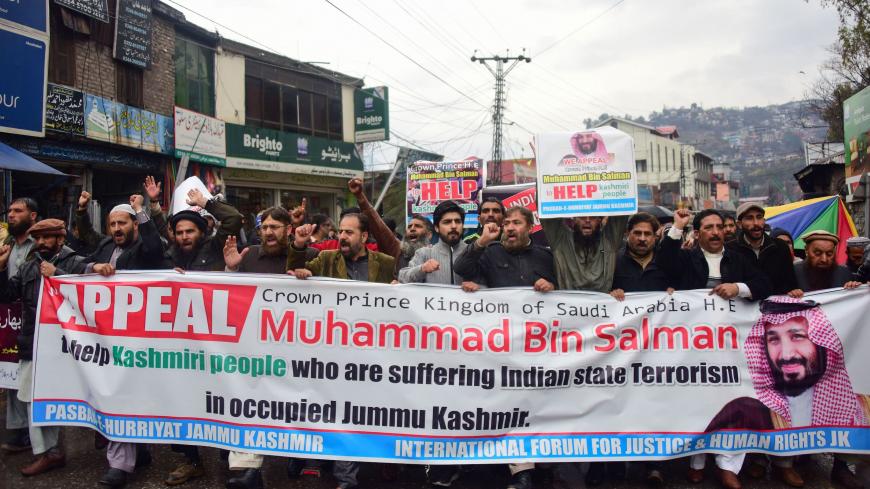 Pakistani Kashmiri from Pasban-e-Hurriyat Jammu Kashmir party, shout slogans as they march during a protest against India in Muzaffarabad, the capital of the Pakistani territory of Azad Kashmir, on February 18, 2019. - Saudi Arabia vowed to "de-escalate" rising tensions between Pakistan and India during a high-profile summit in Islamabad on February 18 as Crown Prince Mohammed bin Salman prepares to travel from Islamabad to New Delhi. (Photo by SAJJAD QAYYUM / AFP)        (Photo credit should read SAJJAD QA