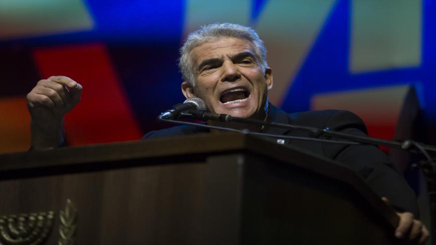 TEL AVIV, ISRAEL - MAY 25: Yair Lapid, Blue and White party member speaks at a protest against Netanyahu's 'Immunity Law'  on May 25, 2019 in Tel Aviv, Israel. Israeli Prime Minster Benjamin Netanyahu attempt to push for laws that will give him immunity from criminal prosecution as part of the coalition agreements for the next goverment.  (Photo by Amir Levy/Getty Images)