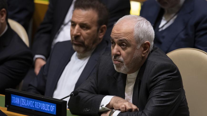 Iran's Foreign Minister Mohammad Javad Zarif listens as Iran's President Hassan Rouhani speaks at the 74th session of the United Nations General Assembly September 25, 2019, in New York. (Photo by Don Emmert / AFP)        (Photo credit should read DON EMMERT/AFP via Getty Images)
