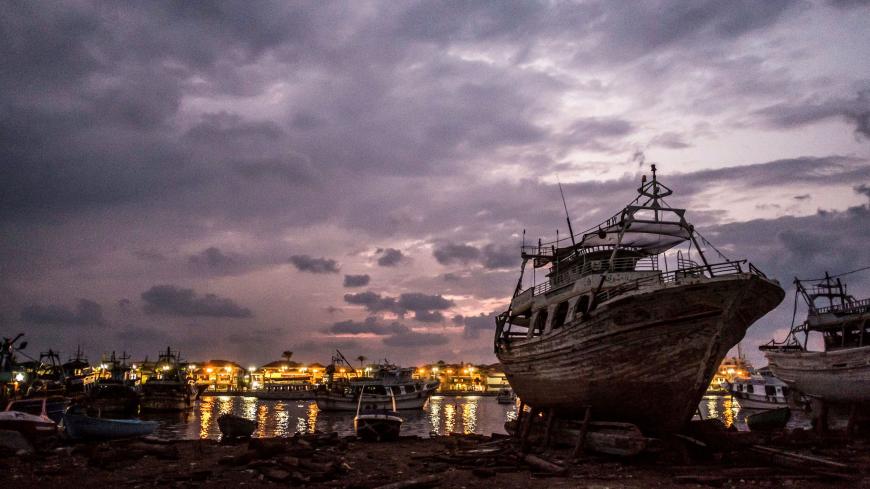 (FILES) In this file photo taken on October 22, 2019 boats are pictured along the riverbank and off the water of the Nile river delta's Damietta branch near the estuary into the Mediterranean sea, in the town of Ezbel al-Borg in Egypt's northern Governorate of Damietta, some 265 kilometres north of the Egyptian capital. - The Nile, Egypt's lifeline since Pharaonic days, faces massive strain from pollution, over-use and climate change -- and now the threat of a colossal dam being built far upstream in Ethiop