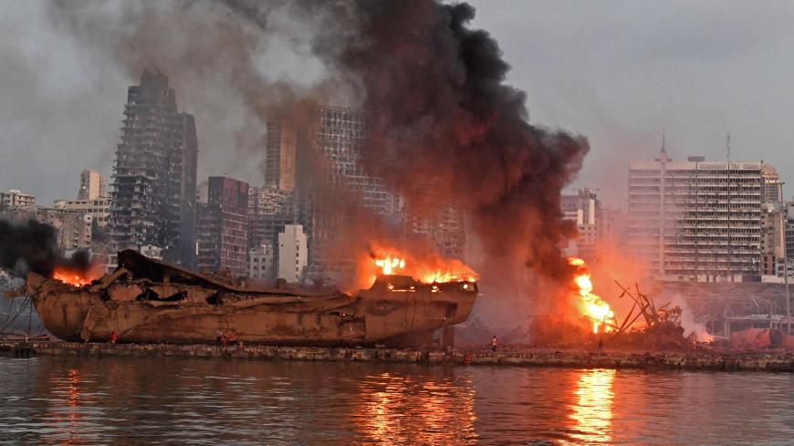 TOPSHOT - A ship is pictured engulfed in flames at the port of Beirut following a massive explosion that hit the heart of the Lebanese capital on August 4, 2020. - Rescuers searched for survivors in Beirut on August 5 after a cataclysmic explosion at the port sowed devastation across entire neighbourhoods, killing more than 100 people, wounding thousands and plunging Lebanon deeper into crisis. (Photo by - / AFP) (Photo by -/AFP via Getty Images)