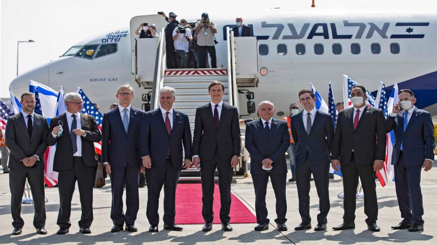 US Presidential Adviser Jared Kushner (C-R) and US National Security Adviser Robert OBrien (C-L) pose with members of the Israeli-American delegation in front of the El Al's flight LY971, which will carry the delegation from Tel Aviv to Abu Dhabi, at the Ben Gurion Airport near Tel Aviv on August 31, 2020. - The El Al flight, scheduled to leave at 0730 GMT from Ben Gurion Airport near Tel Aviv, will carry a delegation led on the American side by President Donald Trump's son-in-law and White House advisor Ja