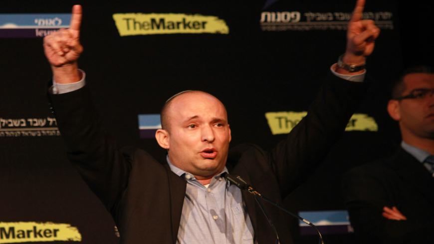 Israeli Economy Minister and head of the far-right Jewish Home party, Naftali Bennett gestures as he gives a speech during a debate on economy on March 11, 2015 in the costal Israeli city of Tel Aviv. Six days before Israel votes in a snap general election, the centre-left Zionist Union opened a lead of several points over the ruling rightwing Likud party, a poll showed. Bennett, 42, is a champion of the settler movement and a key challenger of Netanyahu to head Israel's rightwing.    AFP PHOTO / GIL COHEN-