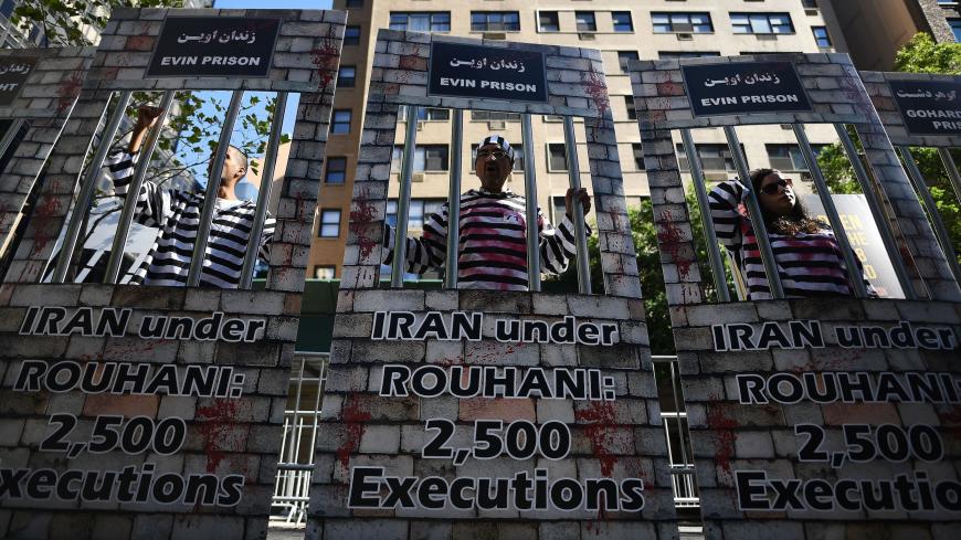 TOPSHOT - Demonstrators protest against Iran's President Hassan Rouhani outside the United Nations headquarters, where Rouhani addresses the 71st session of the United Nations General Assembly, in New York on September 22, 2016.  / AFP PHOTO / Jewel SAMAD        (Photo credit should read JEWEL SAMAD/AFP via Getty Images)