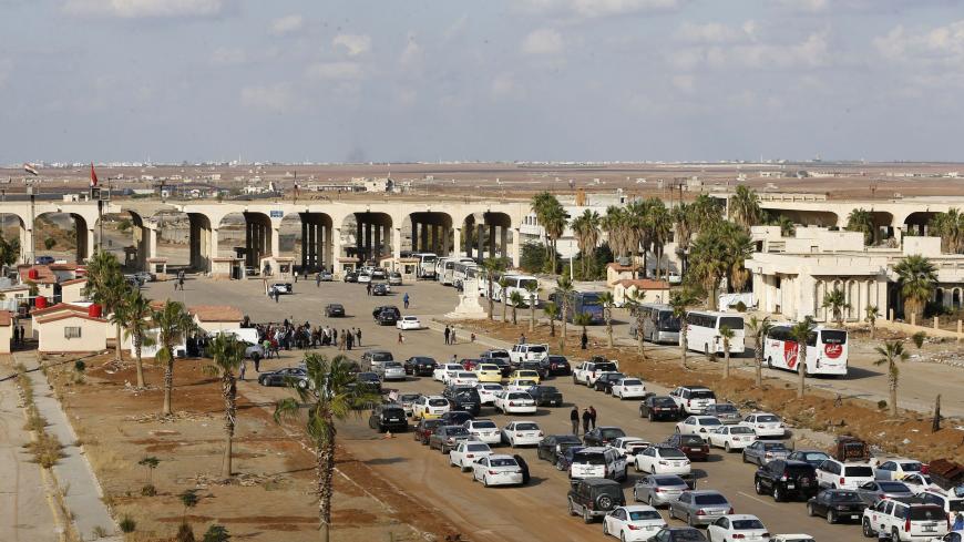 Vehicles wait to cross into Syria at the recently reopened Nassib border post in the Deraa province,at the Syrian-Jordanian border south of Damascus on November 7, 2018. - Syrian regime forces retook control of the Nassib border crossing from rebels in July, and last month reopened it after a three-year closure, allowing Jordanians to dash over for cheap shopping. (Photo by LOUAI BESHARA / AFP)        (Photo credit should read LOUAI BESHARA/AFP via Getty Images)