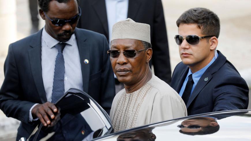 Chadian President Idriss Deby (C) enters his car as he departs from the Yad Vashem Holocaust Memorial museum in Jerusalem on November 26, 2018, after his visit to the site commemorating the six million Jews killed by the German Nazis and their collaborators during World War II. (Photo by MENAHEM KAHANA / AFP)        (Photo credit should read MENAHEM KAHANA/AFP via Getty Images)
