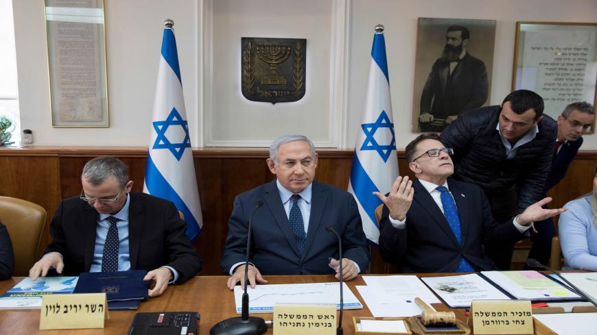 Israeli Prime Minister Benjamin Netanyahu(C), Cabinet Secretary Tzachi Braverman(R)  and Tourism Minister Yariv Levin (L) attend the weekly cabinet meeting at prime minister's office in Jerusalem on January 27, 2019. (Photo by ABIR SULTAN / POOL / AFP)        (Photo credit should read ABIR SULTAN/AFP via Getty Images)